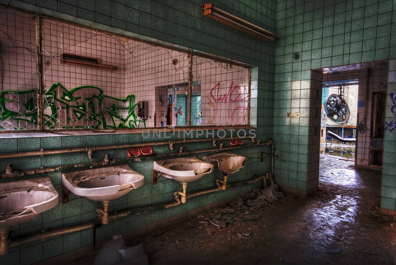 bathroom with sinks and a missing mirror