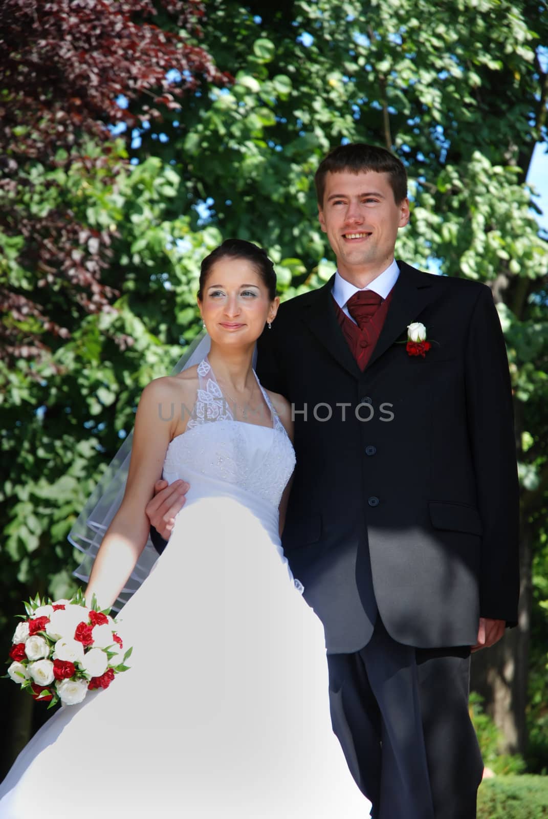 Young wedding couple just married over green nature