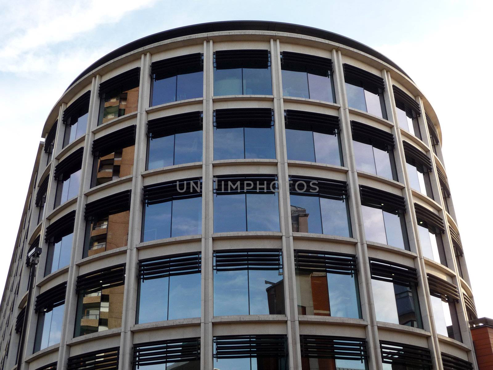 A modern office building that is curved.