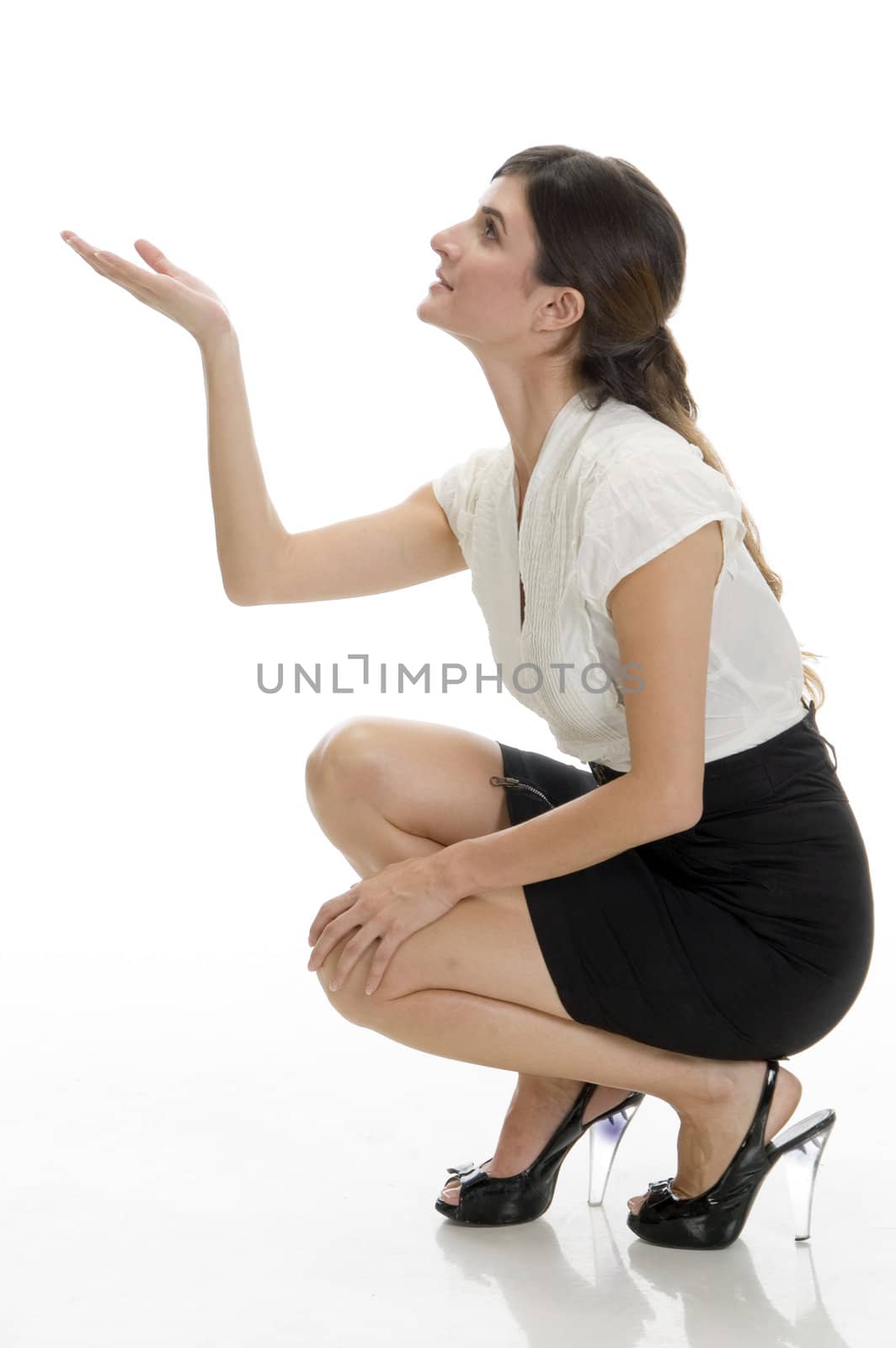 sitting lady looking upside on an isolated background