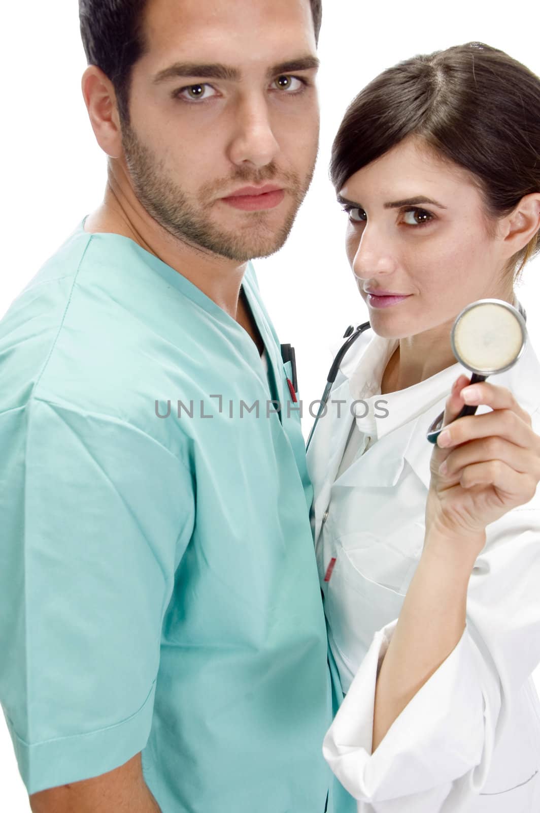 nurse standing with patient showing stethoscope with white background