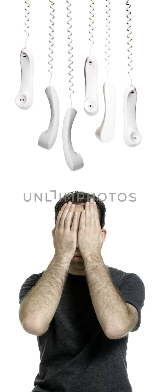 A young man who hates phone calls is hiding from all the telephone receivers, isolated against a white background.