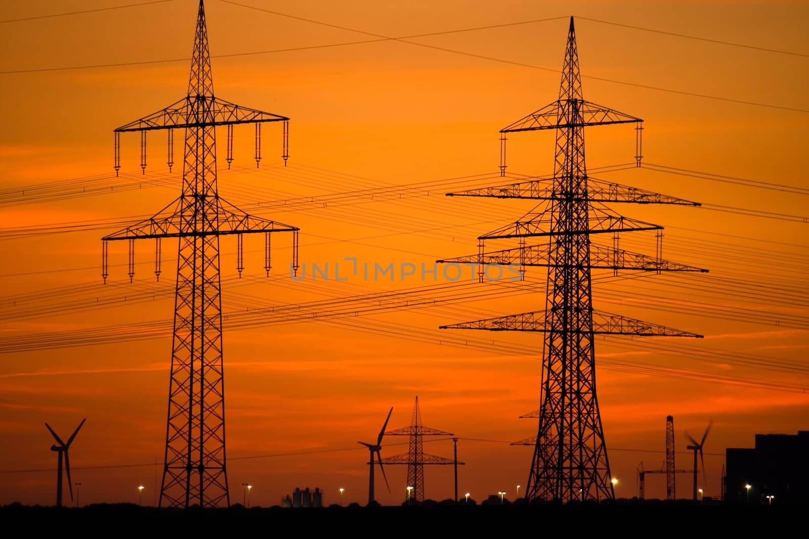 Power Lines and Wind Turbines at Sunset