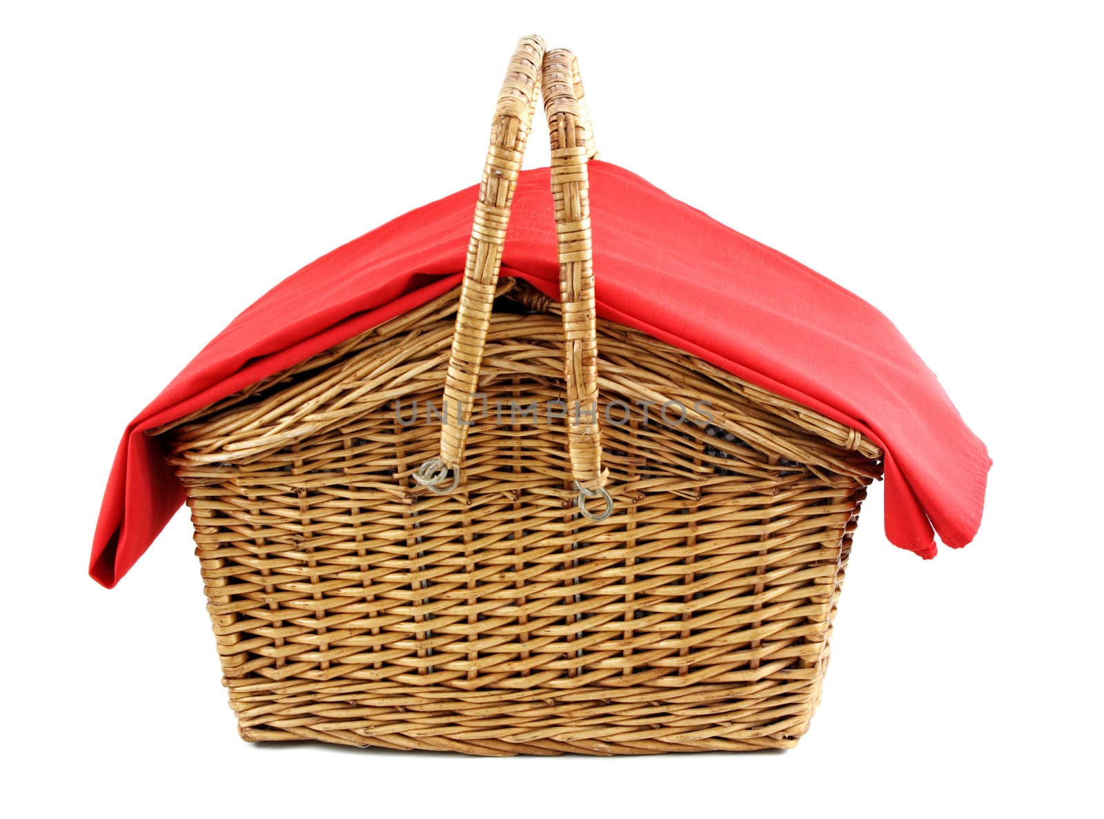 wicker picnic basket with red tablecloth