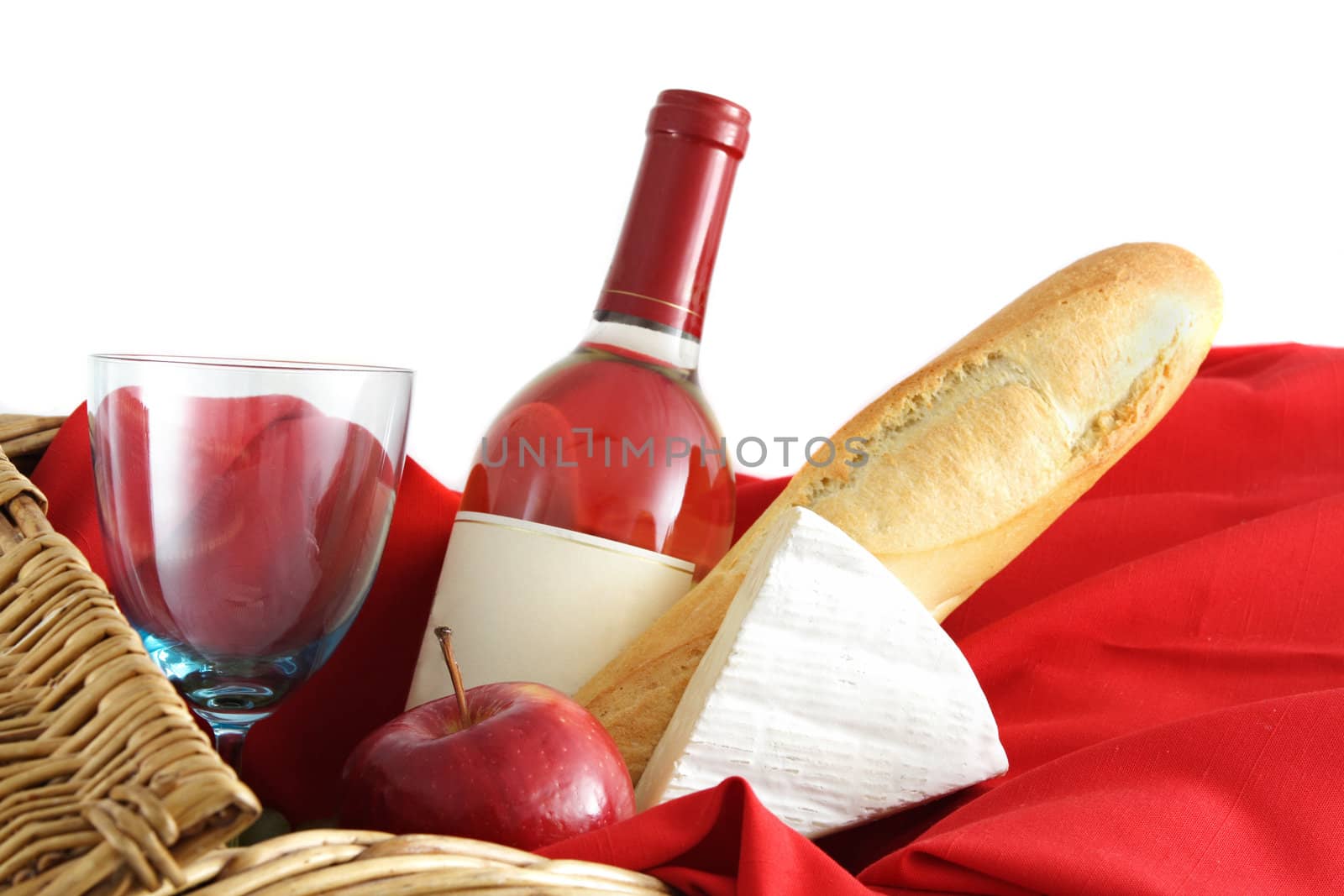 closeup on picnic basket food and wine