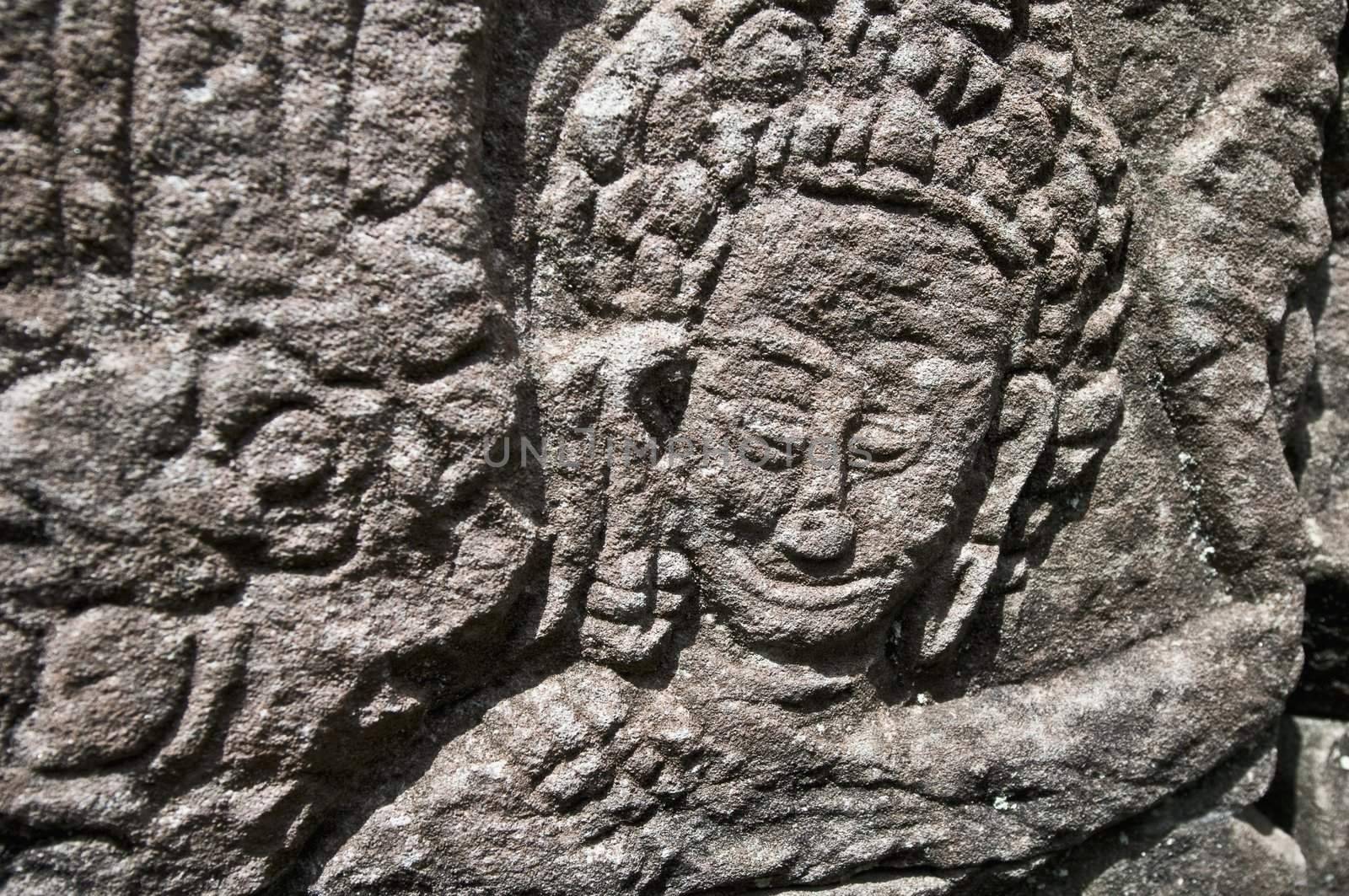 Details on the walls of Bayon within the Angkor Temples, Cambodia