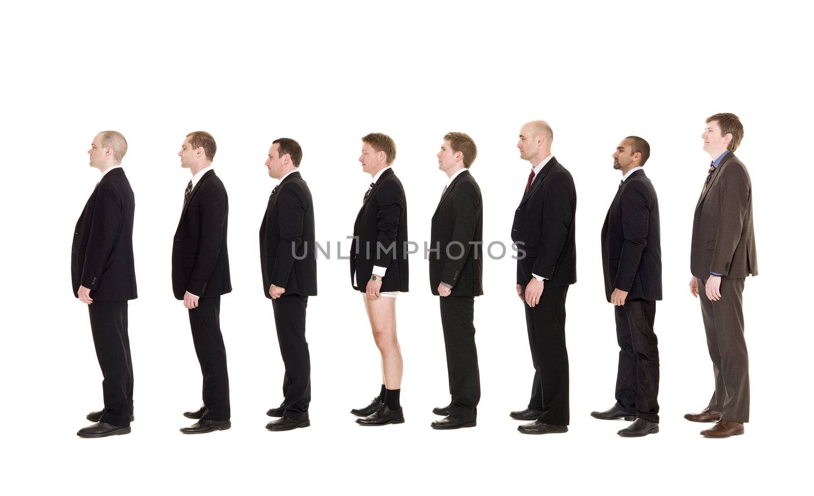 Man without pants standing on a line with other men