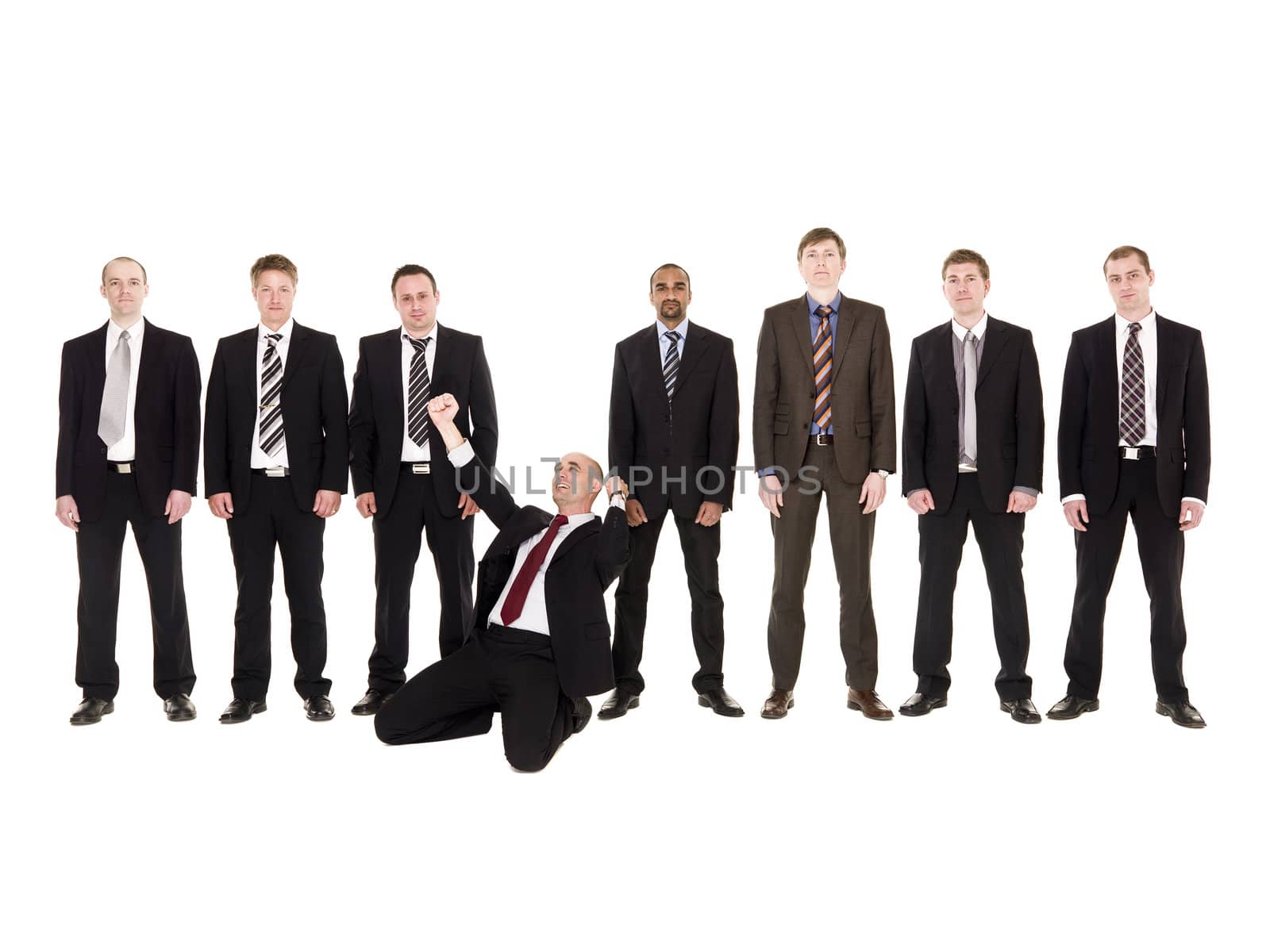 Happy businessman in front of his team isolated on white background