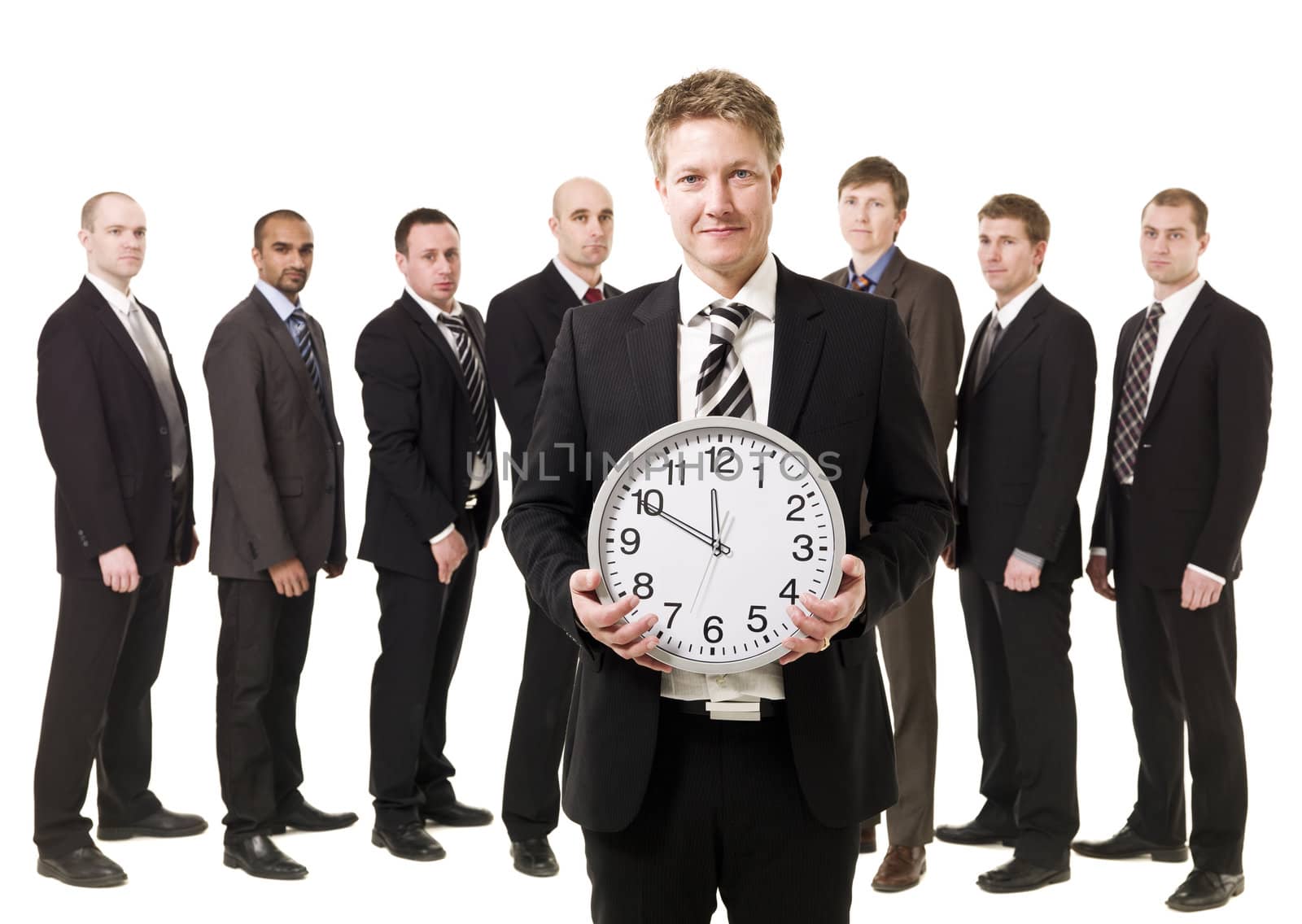 Business Manager with a clock in front of his team