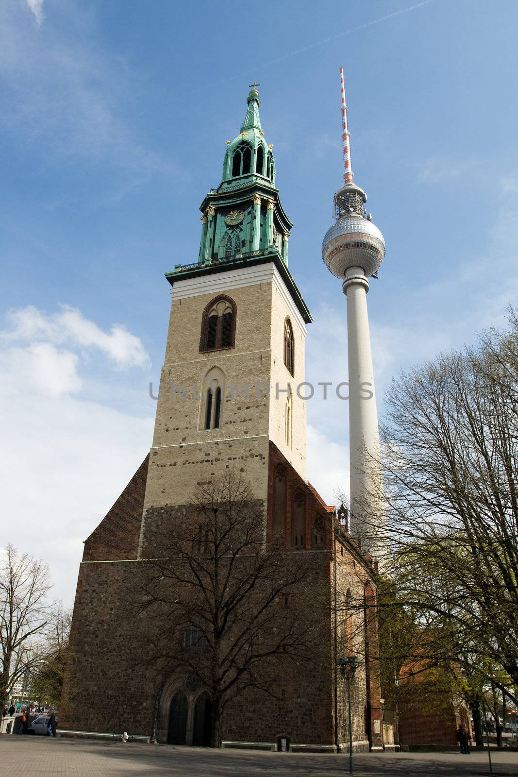 Berlin TV tower or Fernsehturm and St. Mary's Church in Alexanderplatz. The Fernsehturm is the fourth tallest freestanding structure in Europe.