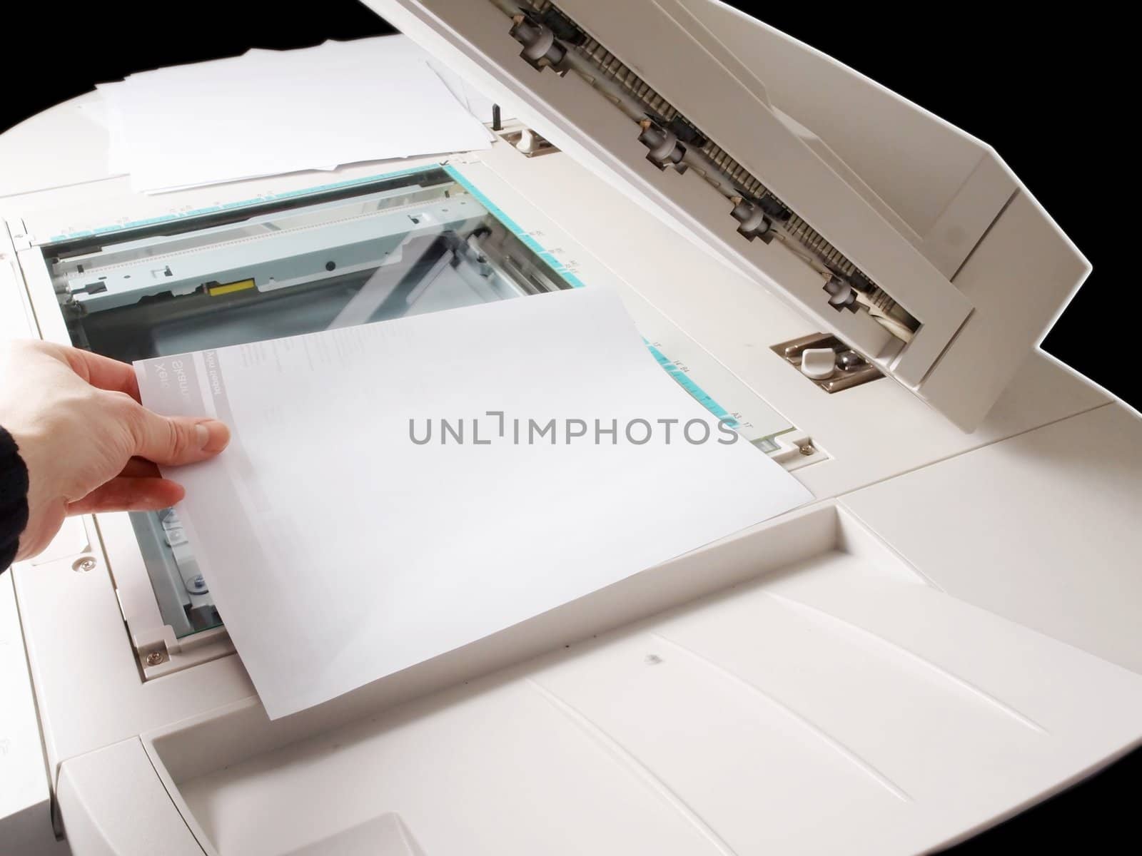A person handling a multi purpose copier machine