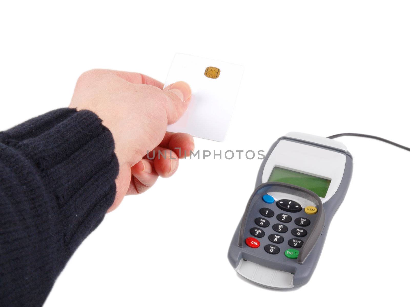 Someone handing over a debit-/credit-card with chip to the non visable cashier,  against white background 