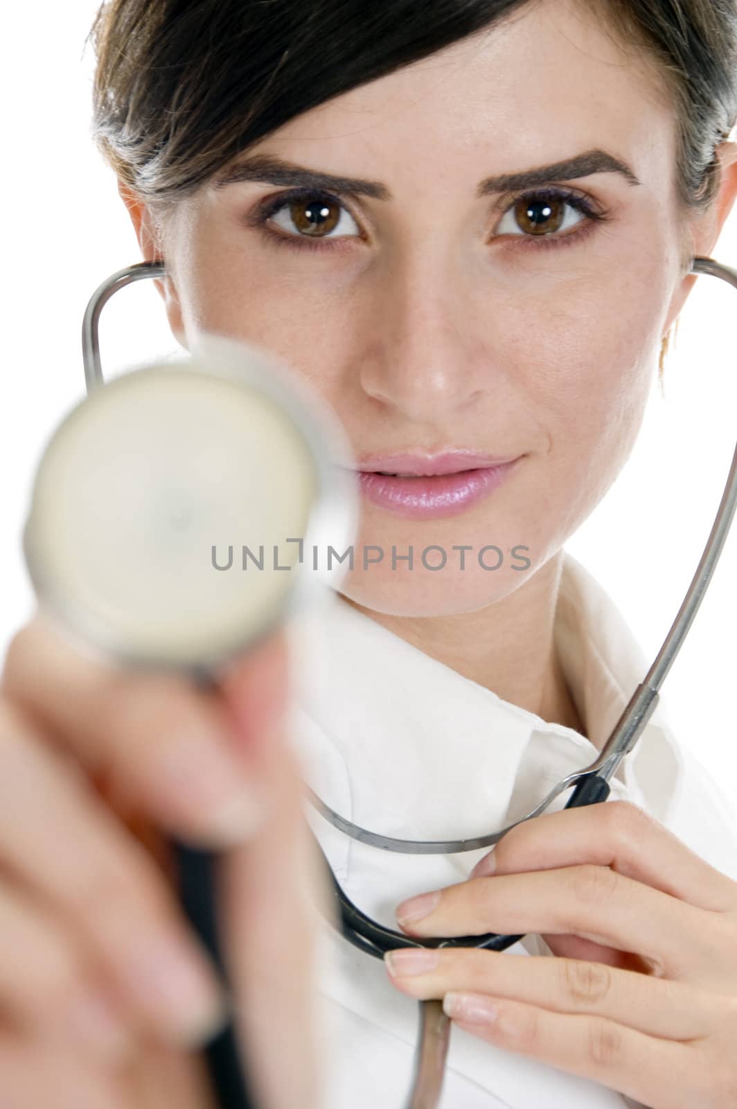 beautiful lady doctor showing stethoscope against white background