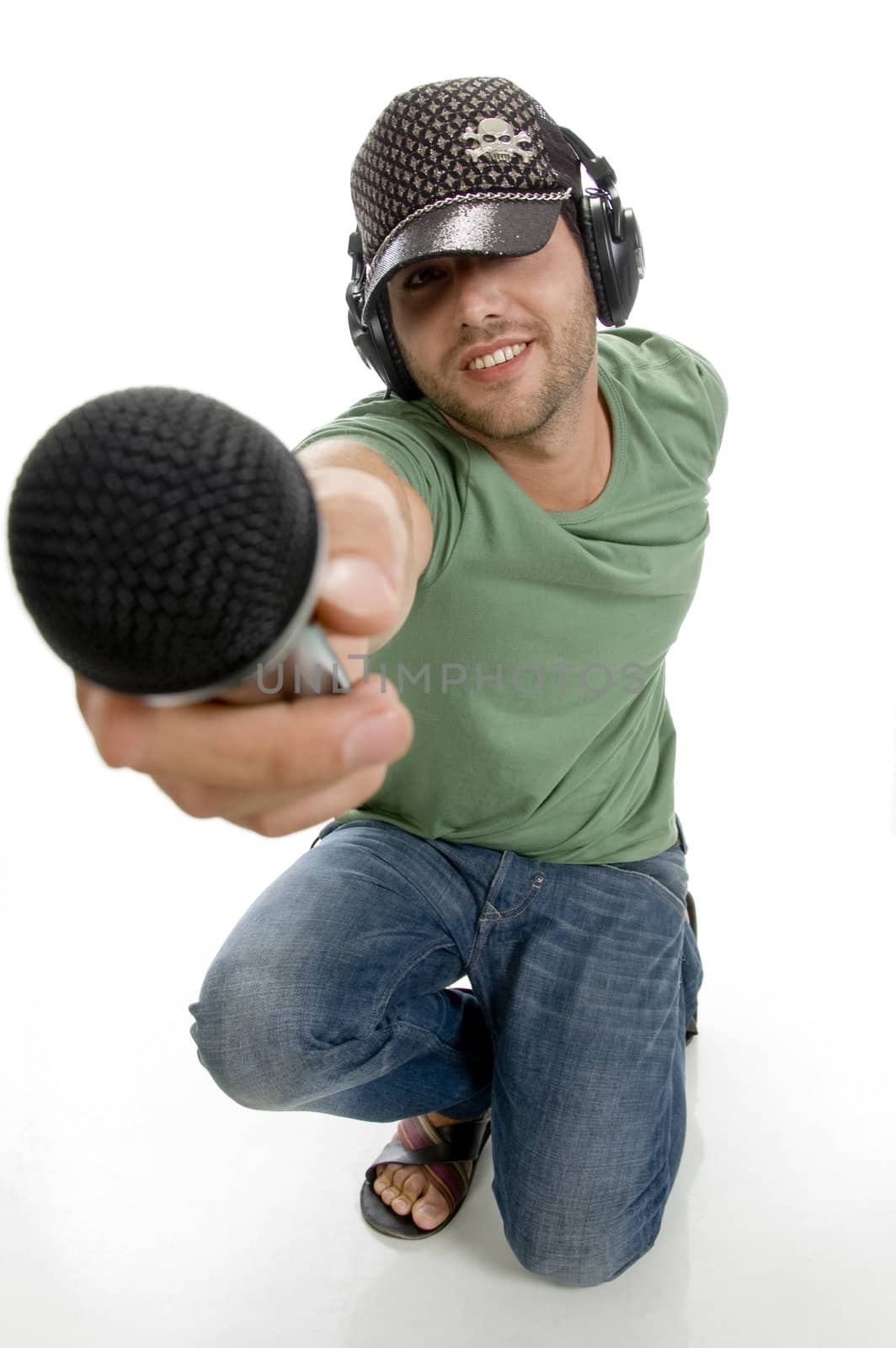 smart male showing microphone on an isolated white background