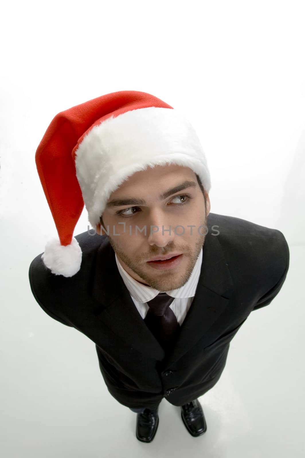 top view pose young businessman wearing santa cap on an isolated white background