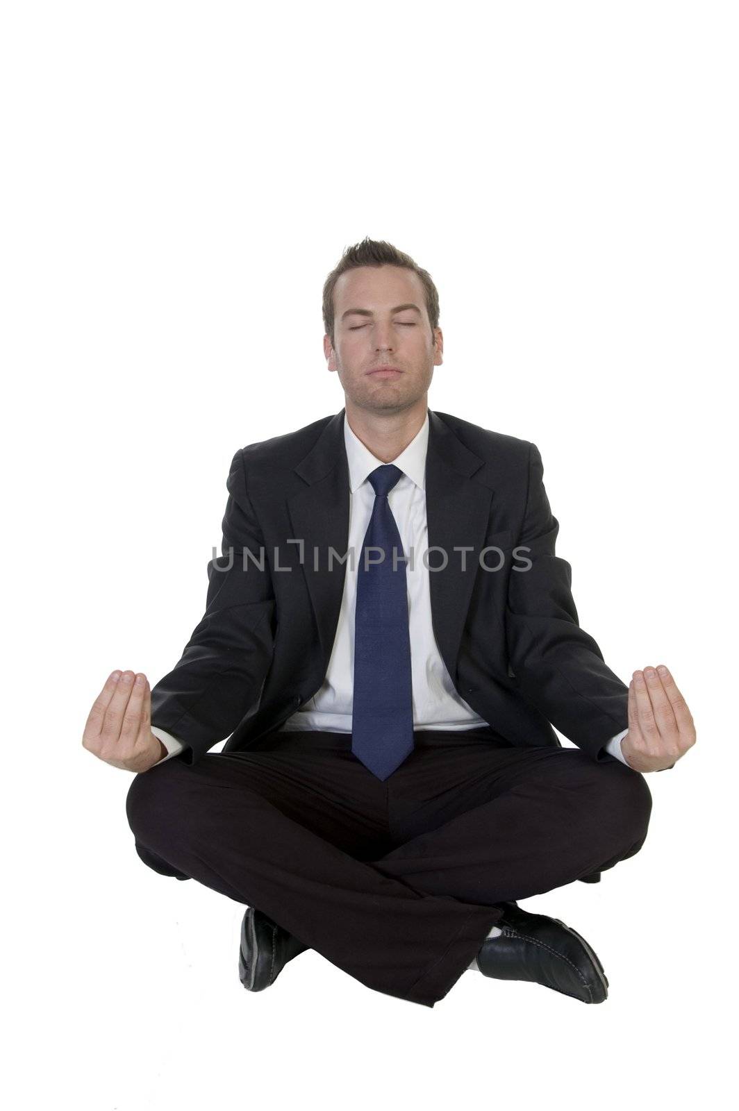 businessman doing meditation by imagerymajestic