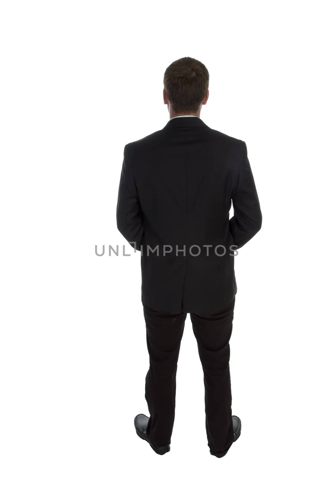 standing businessman posing from back on an isolated white background