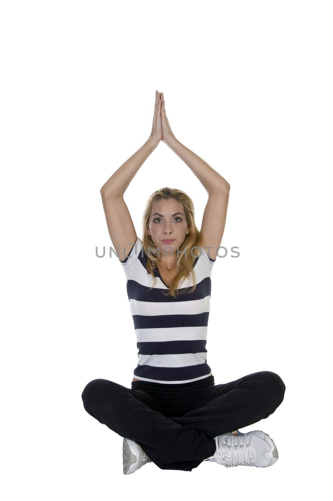 young woman in yoga pose against white background