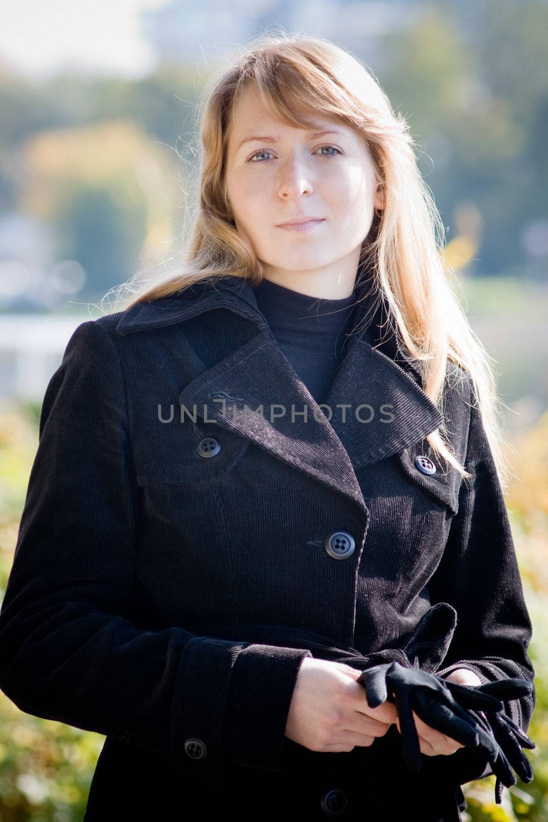 Portrait of beautiful woman in a park by Amidos