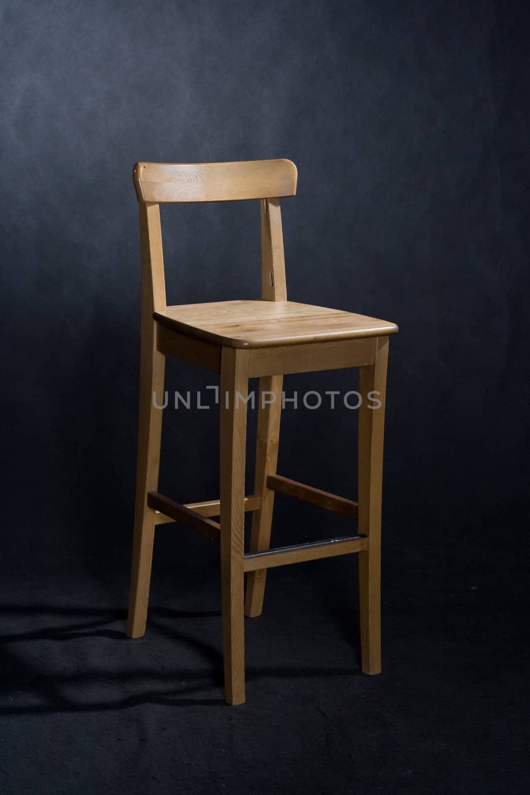 wooden lacquered chair on black
