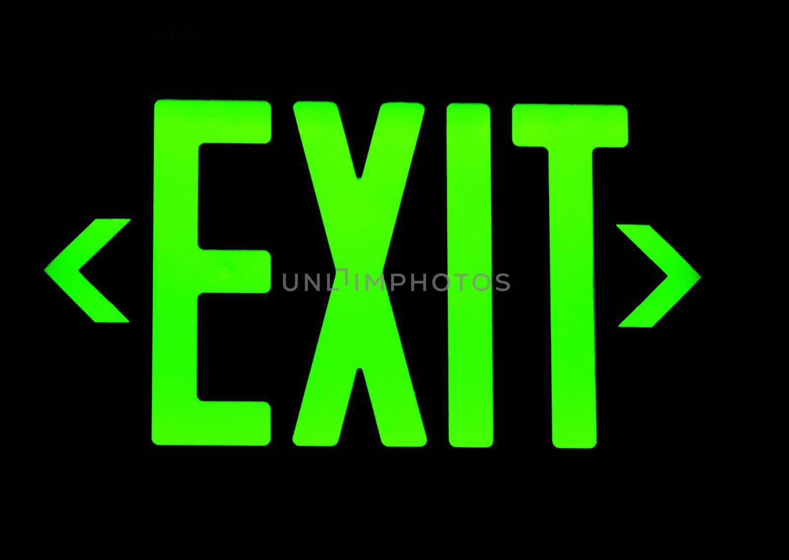 Green exit neon sign on black background