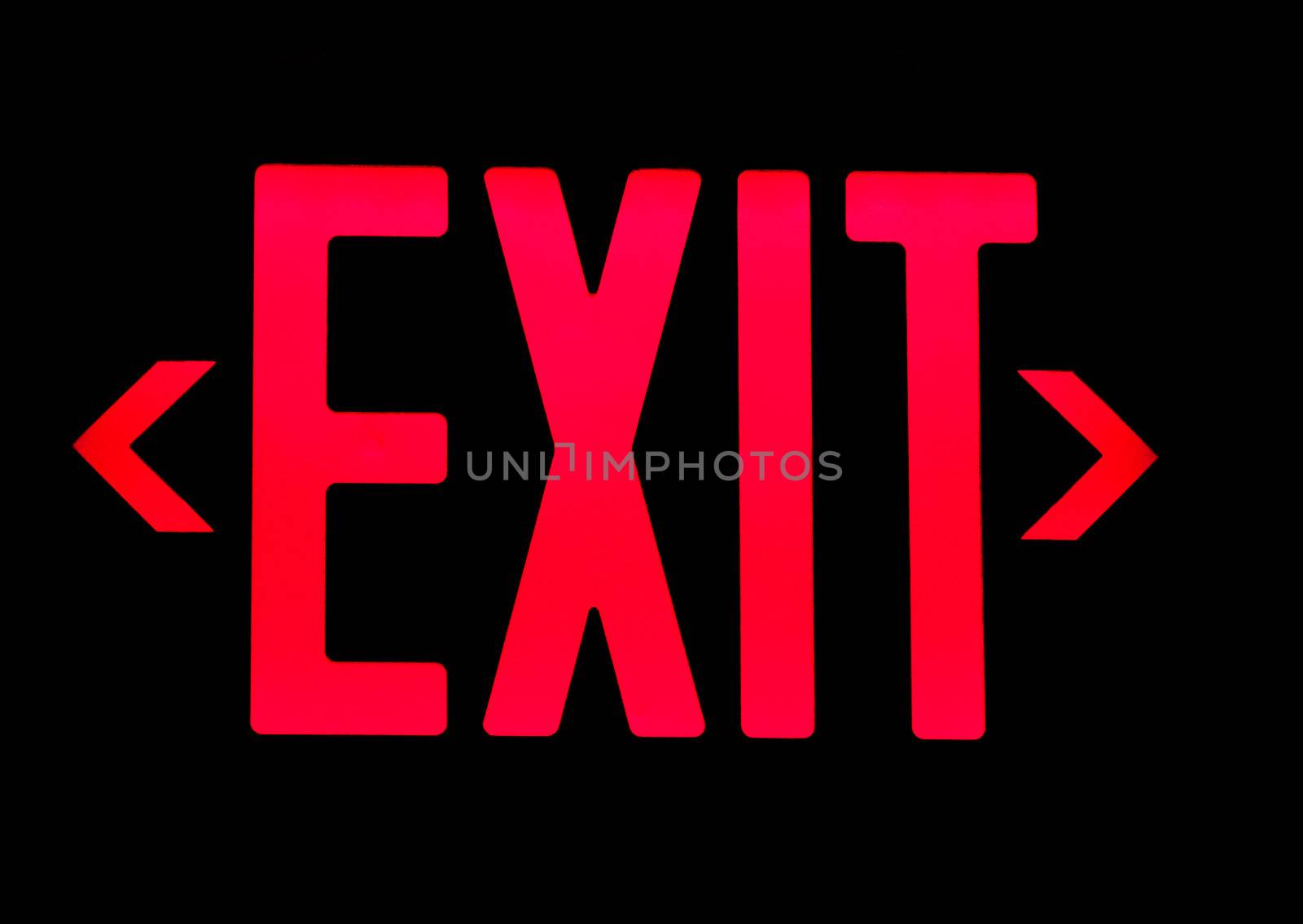 Red exit neon sign on black background