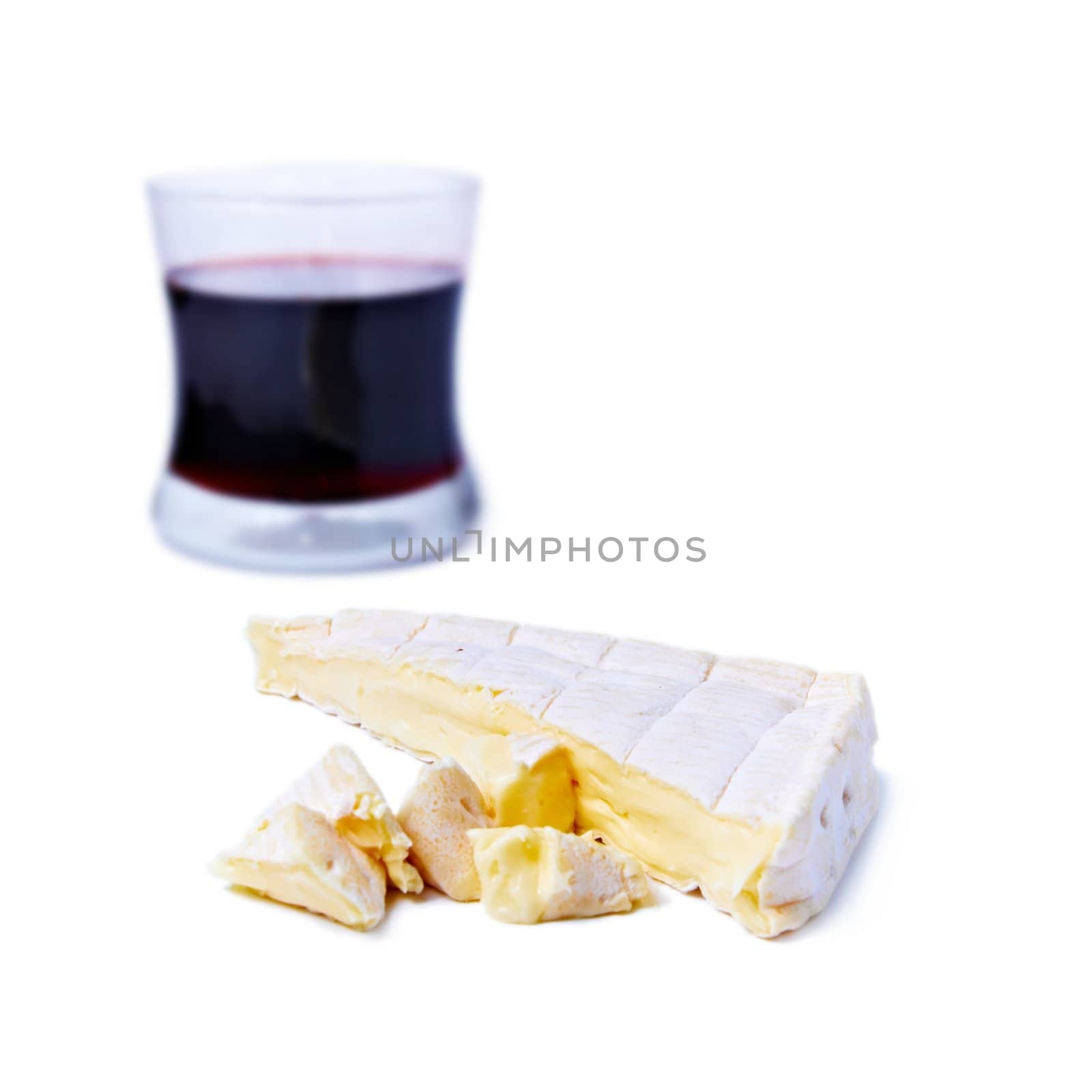 Brie cheese and gas of red wine isolated on white