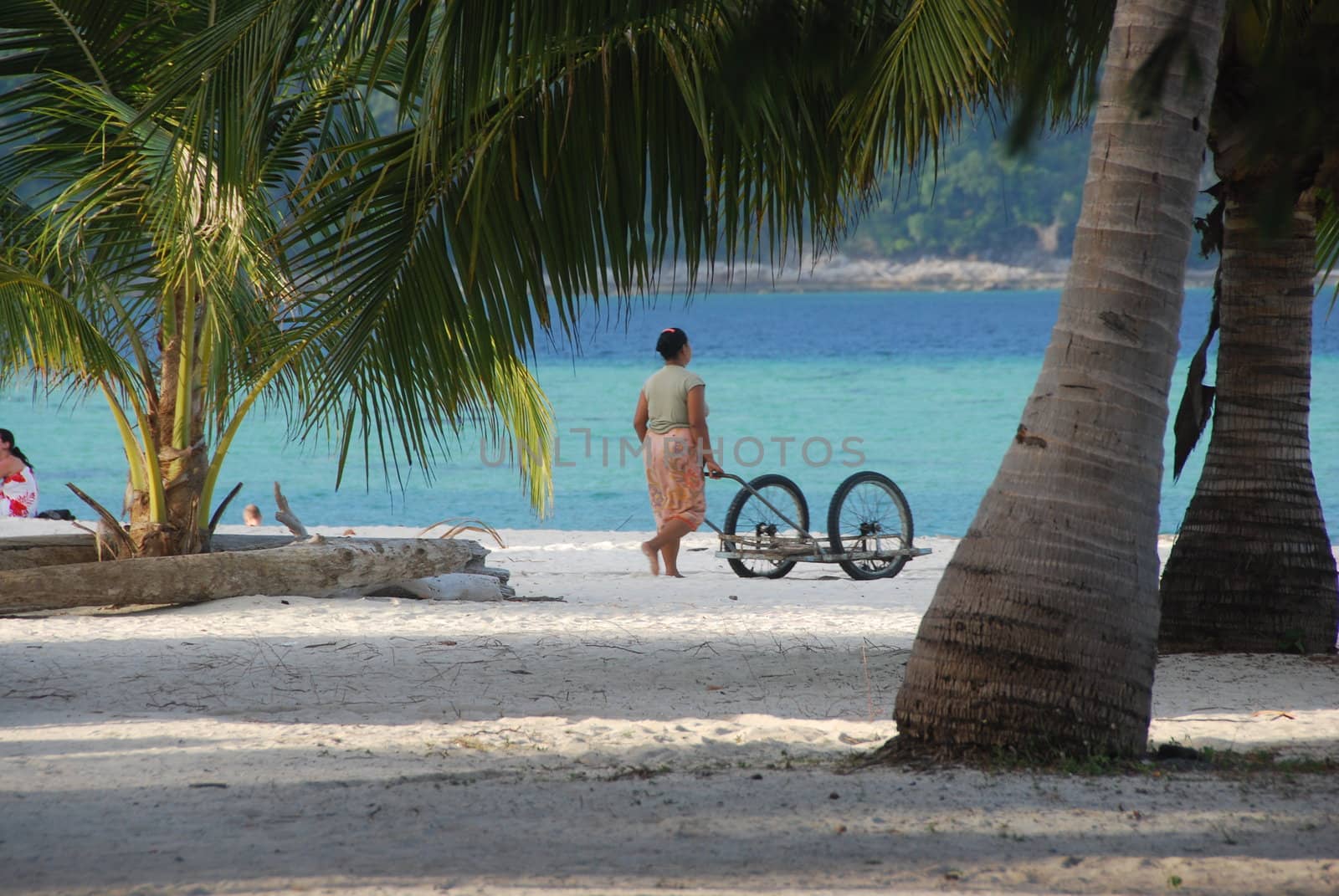 Woman working on a tropical beach