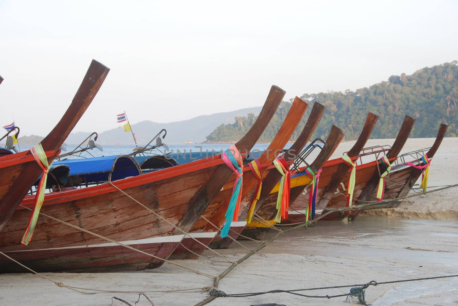 Longtail boats on a tropical beach
