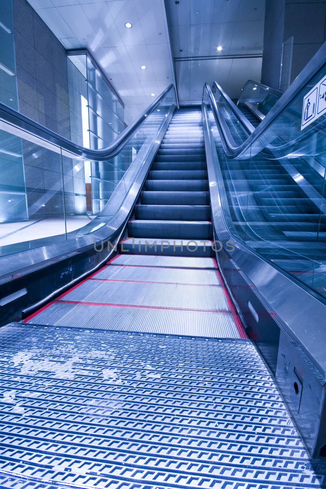 escalators in a building in hong kong at night