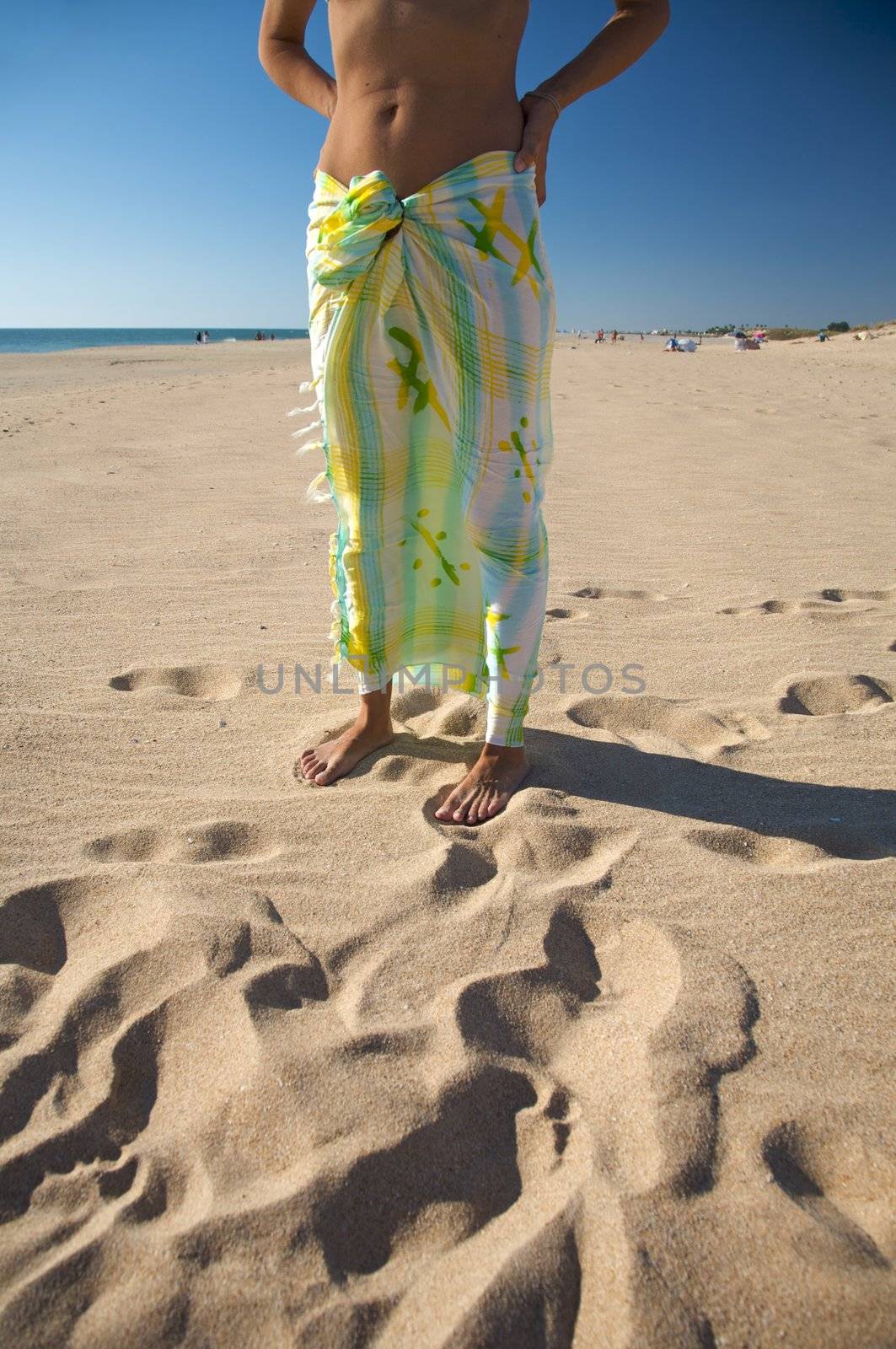 woman with beach wrap at el palmar beach in cadiz spain
