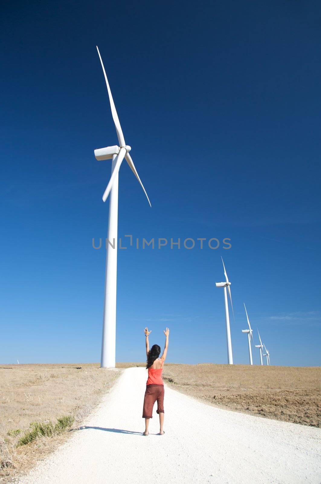 woman and energy mills at the country of facinas village in cadiz spain