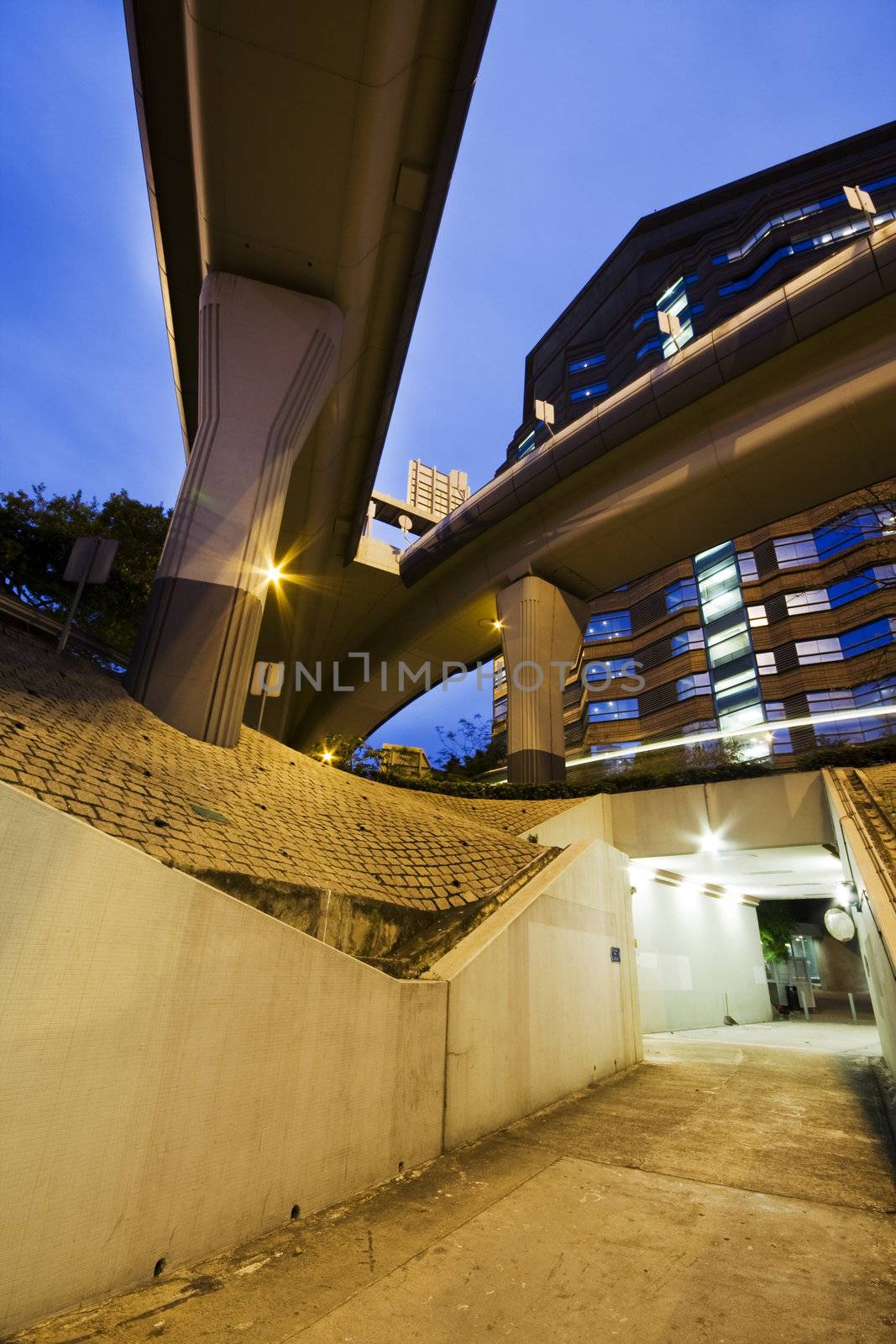 long tunnel with lamps and nobody walking