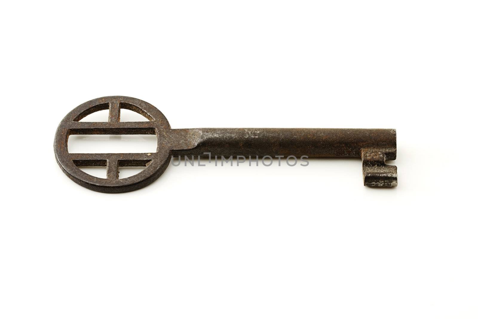 one small rusty key on white background
