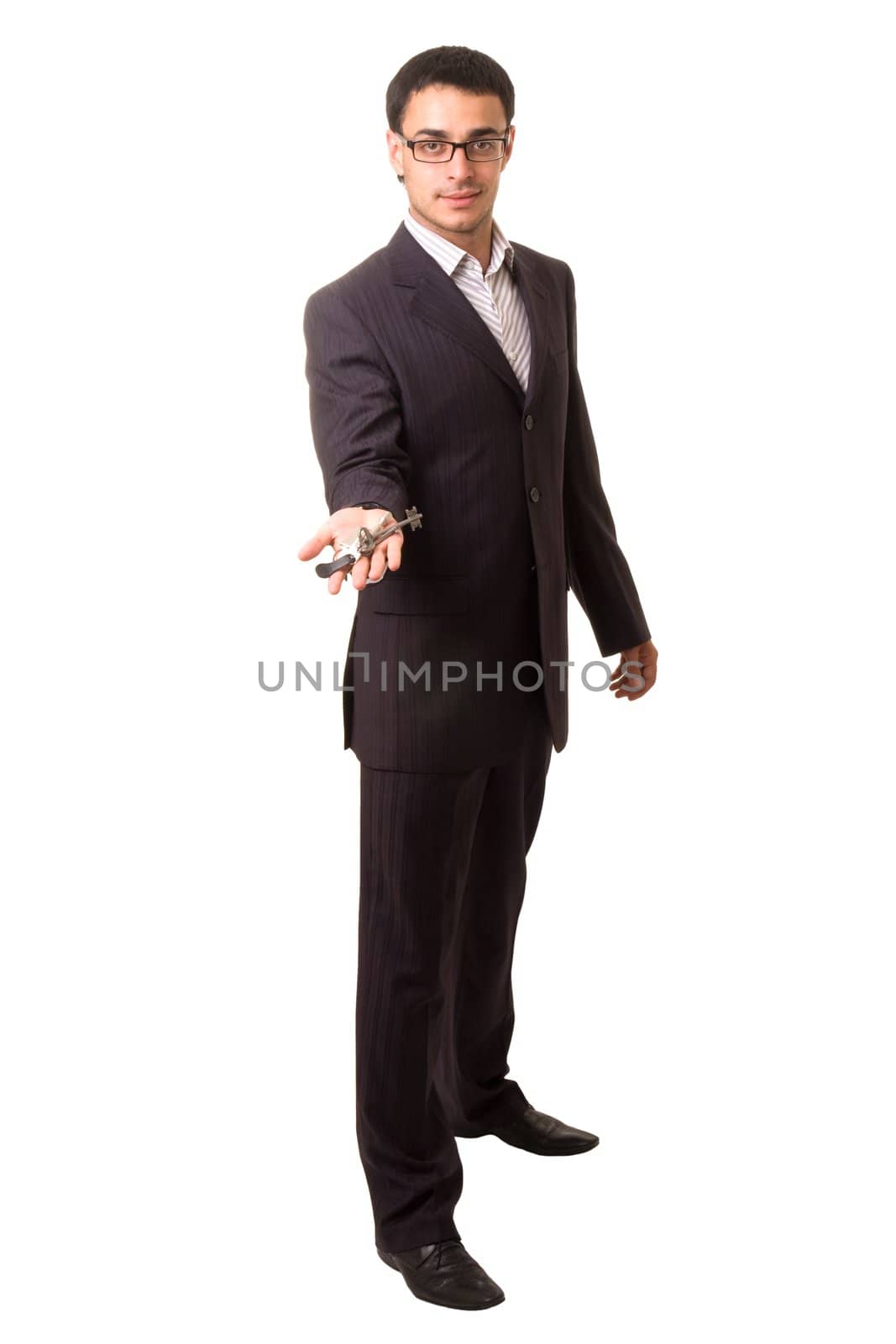 smiling businessman with keys on a white background