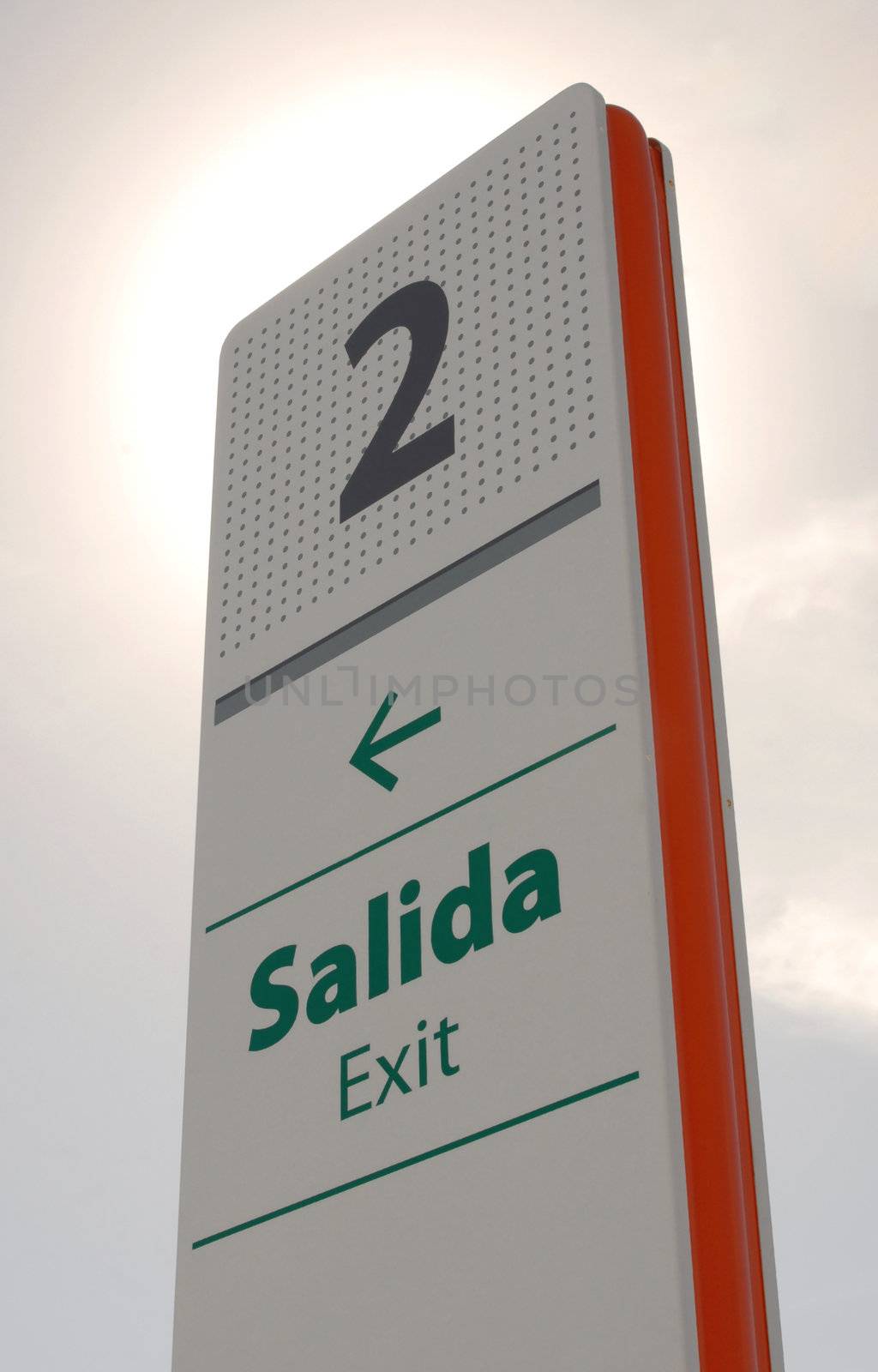 perspective of exit signpost with number two and green arrow