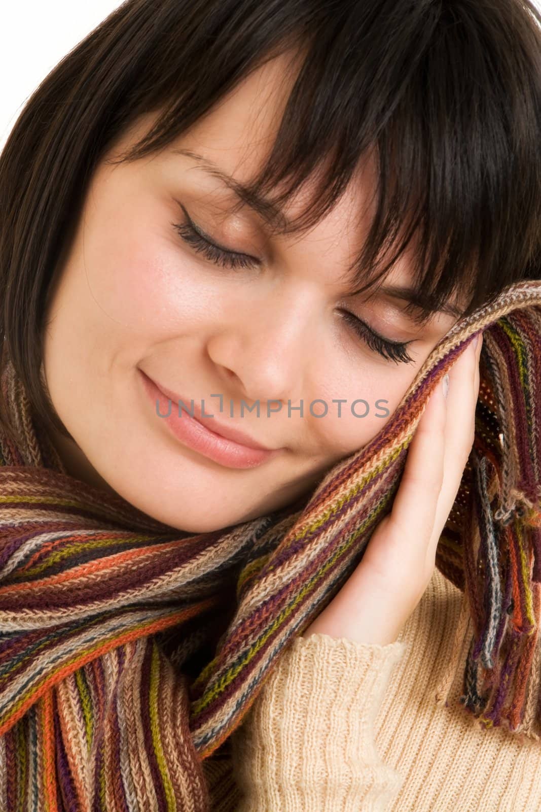 Beautiful young woman with scarf close up.