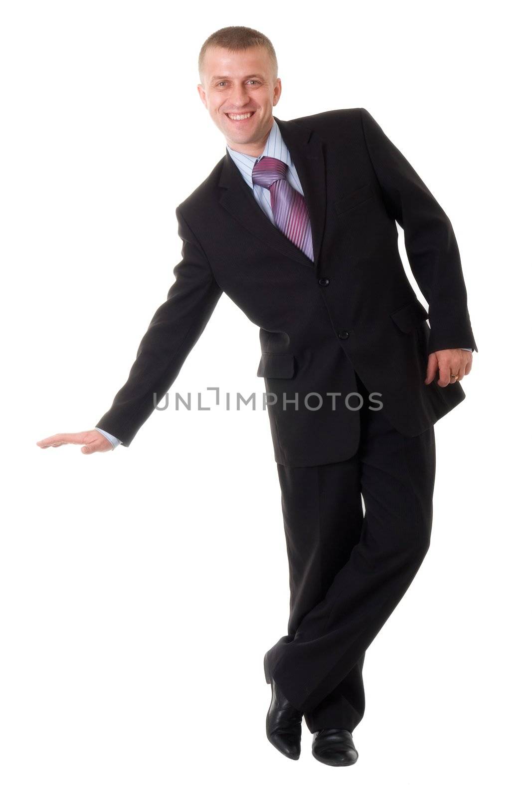 smiling young businessman standing against isolated white background