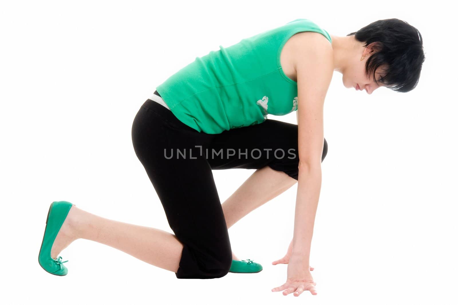 crouch start. young woman isolated on white background