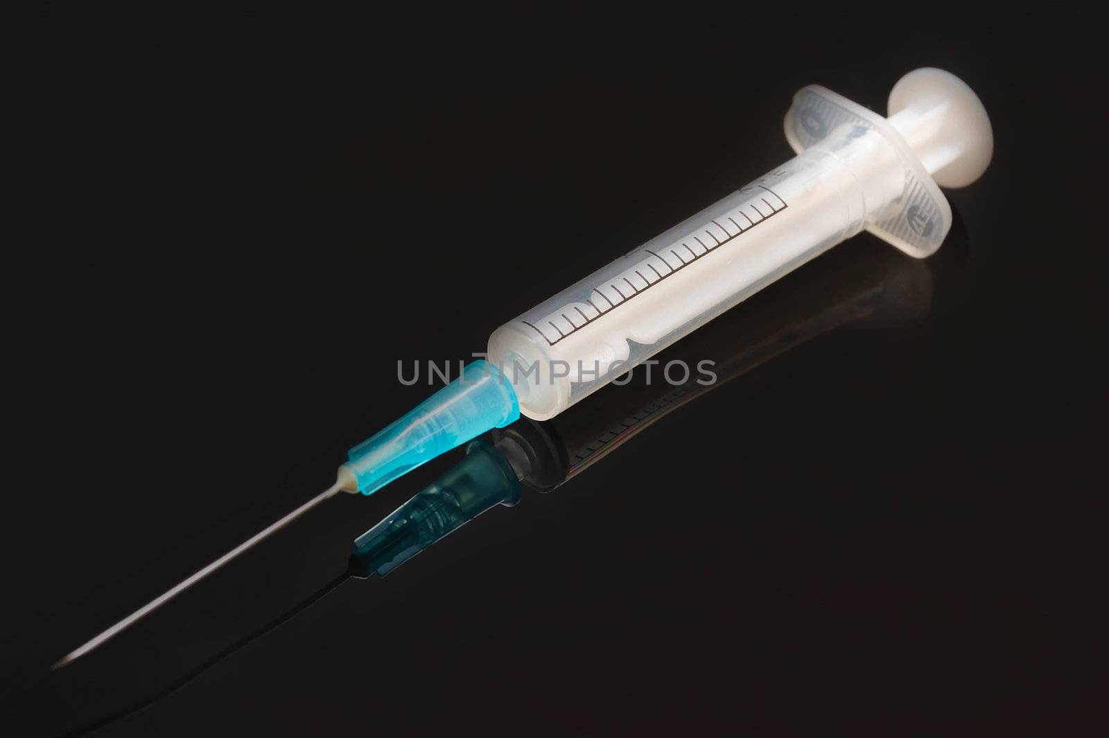 medicine tool  - syringe against black