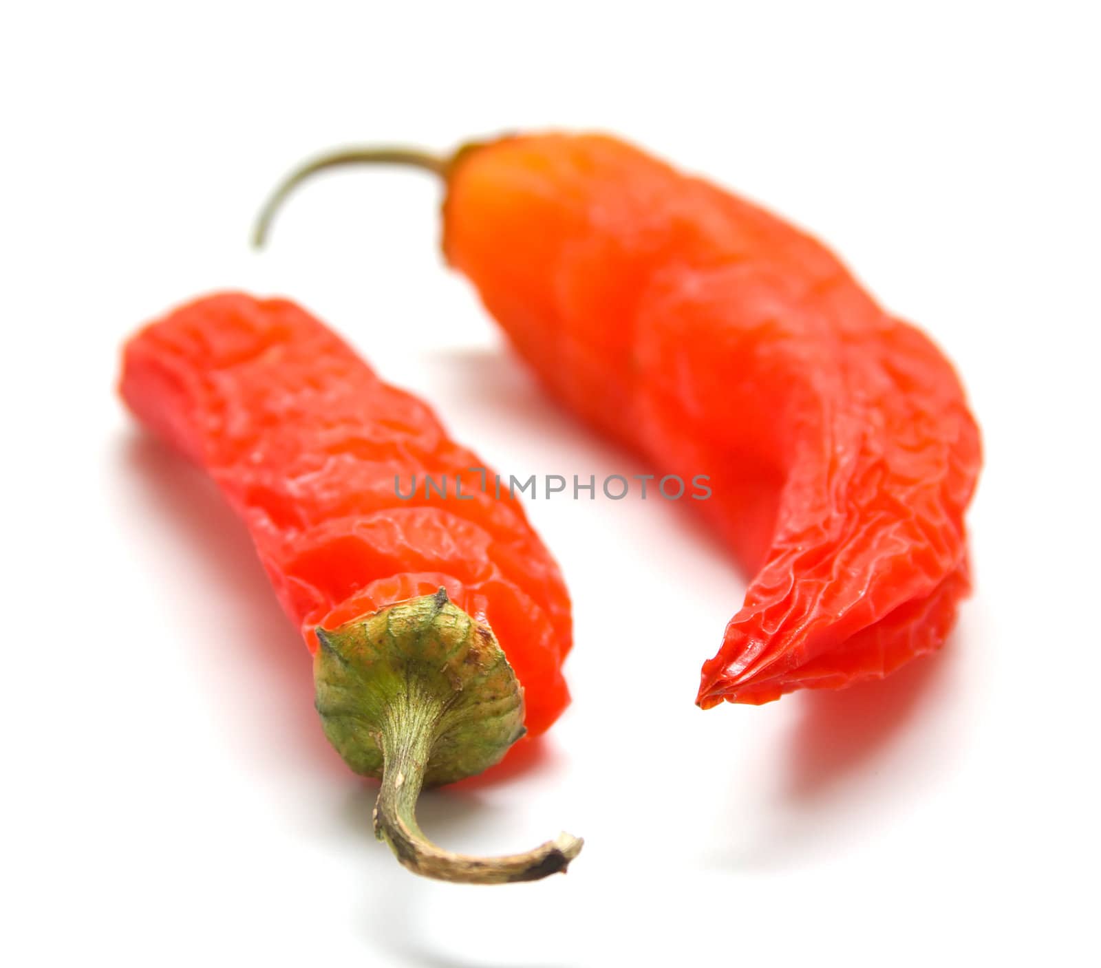 Red peppers on a white background. Isolation, shallow DOF
