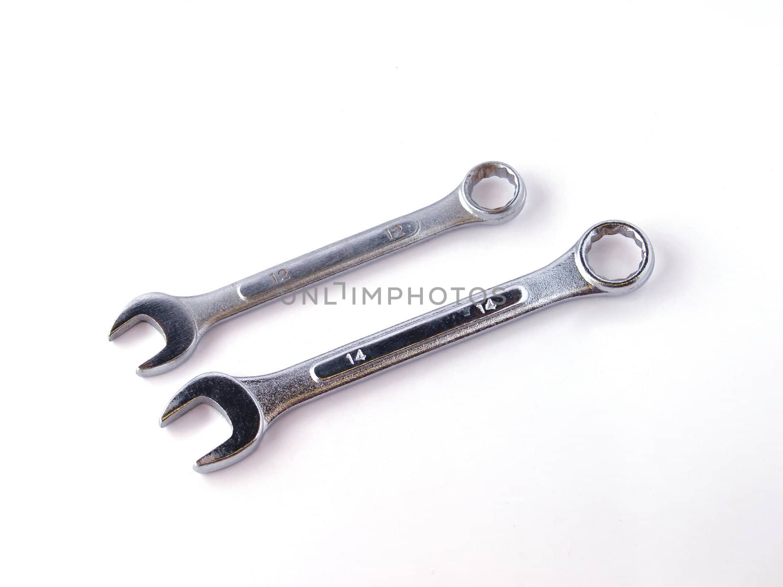 Two chrome spanners on a white background.