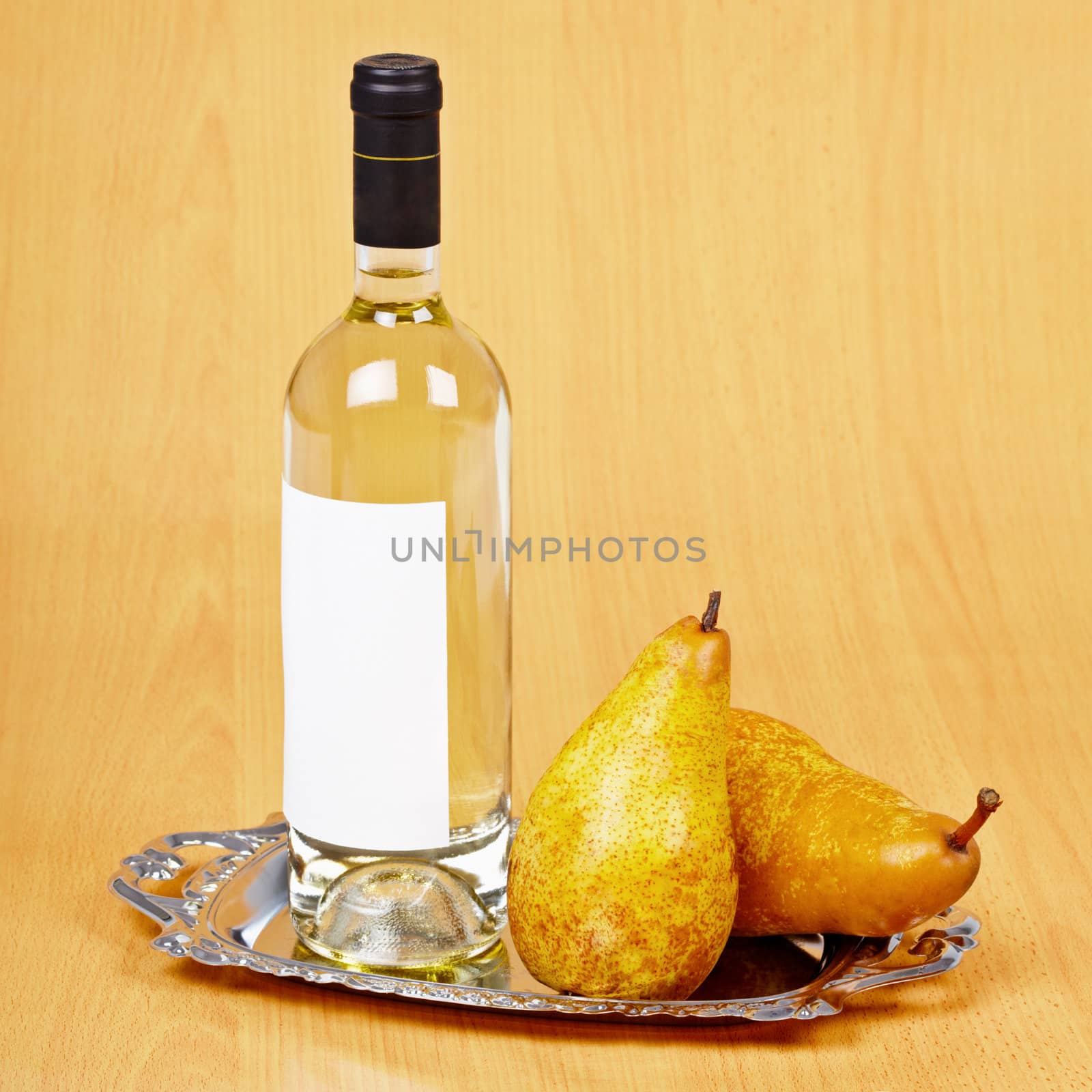 Still life from a bottle of pear wine on the table