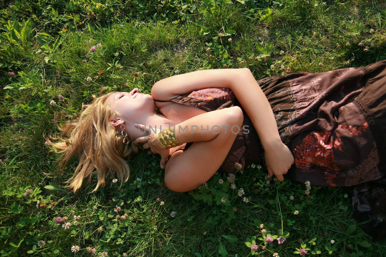 Young woman lying on the grass