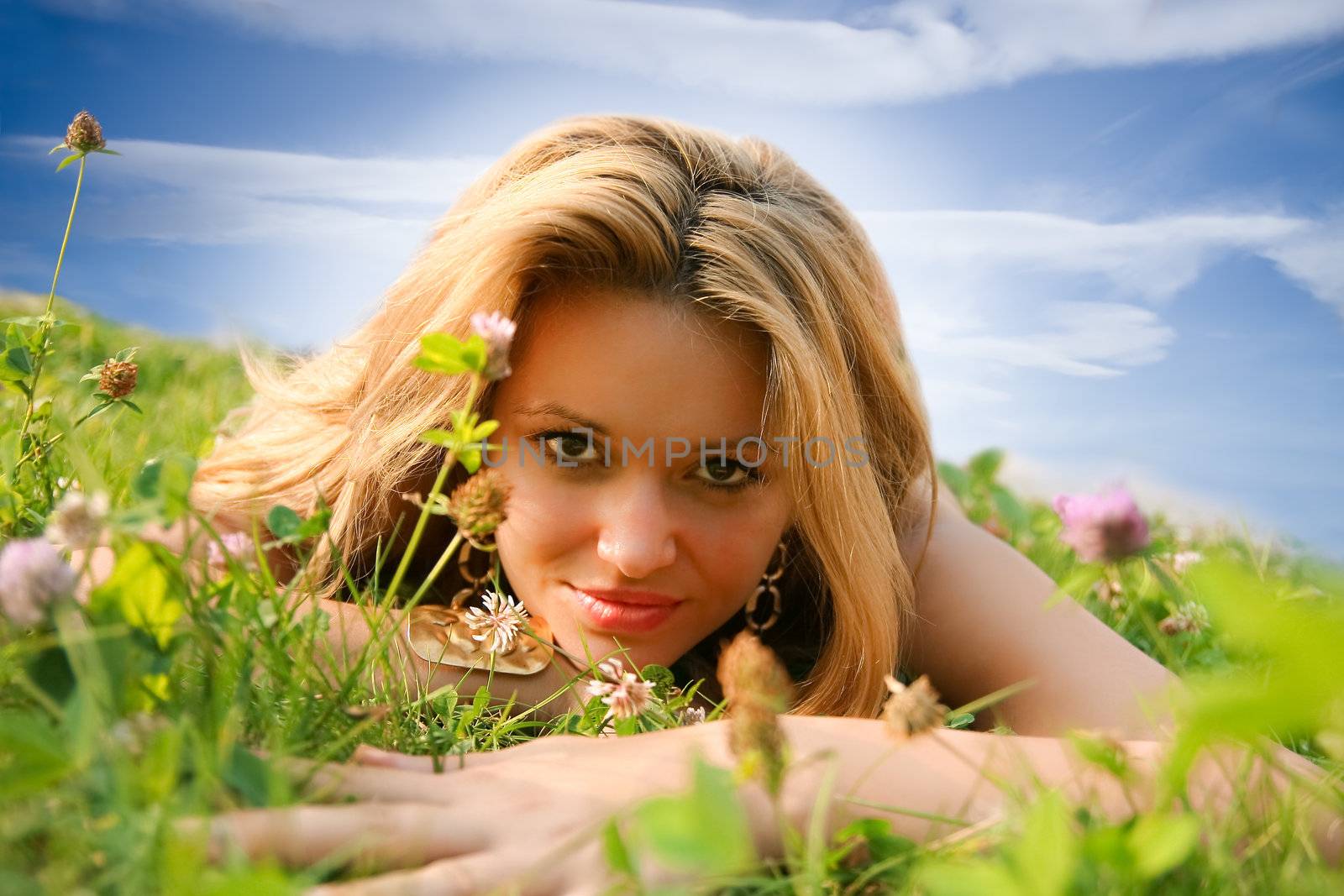 Young woman lying on the grass