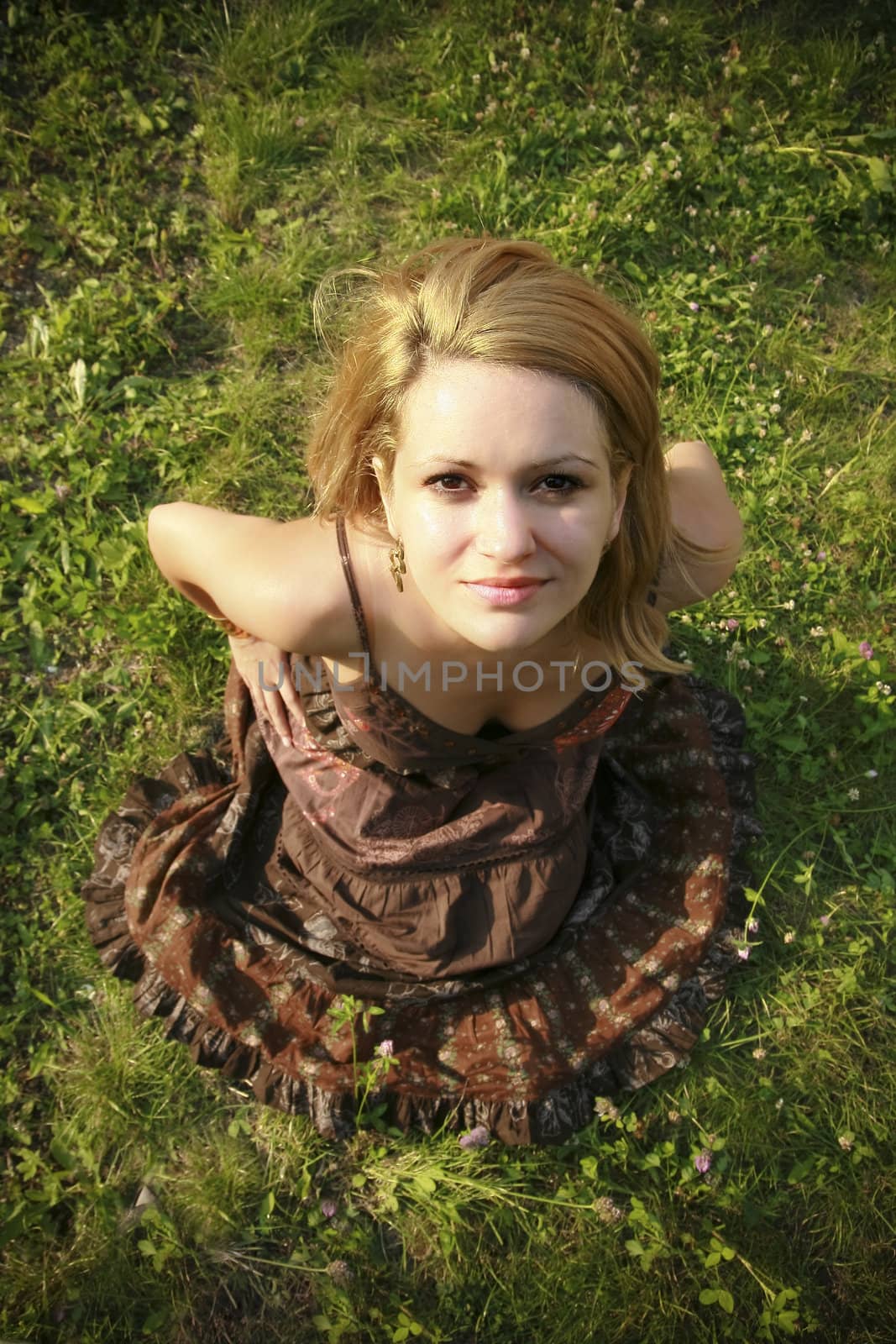 Beautiful woman lying down in summertime.