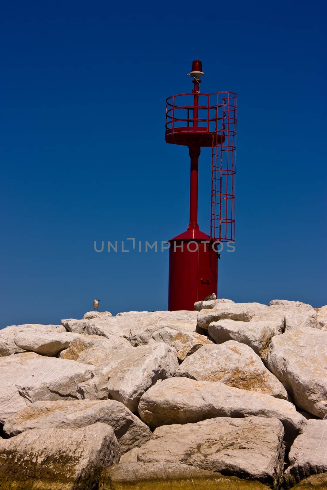 Red Beacon on coast on Ponza island, Italy.