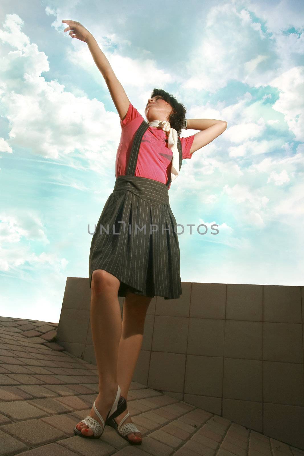 Girl with hands raised