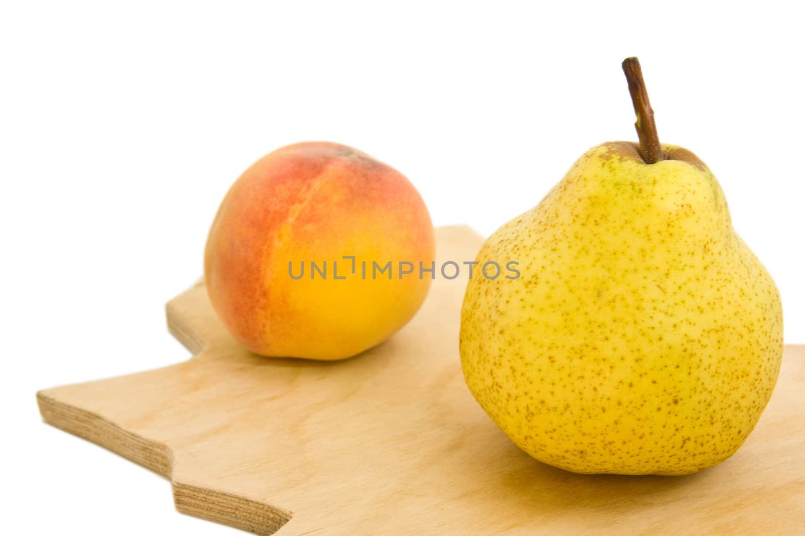 Appetizing pear and peach isolated over white