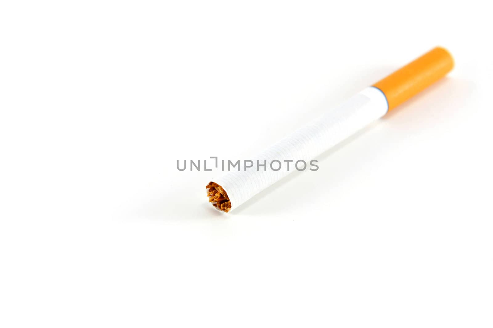 A single unlit cigarette isolated on white by ChrisAlleaume